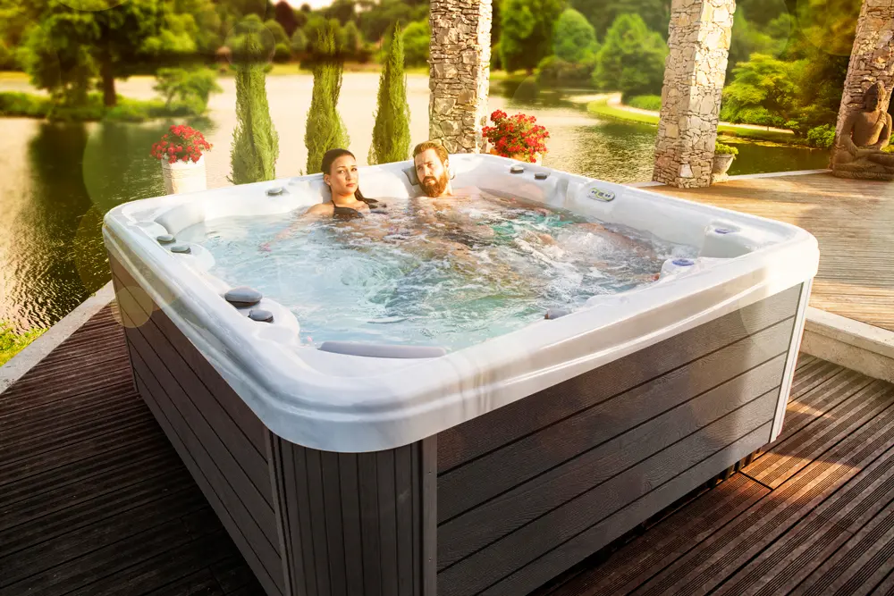 Picture of a couple sitting in a 5-person hot tub.