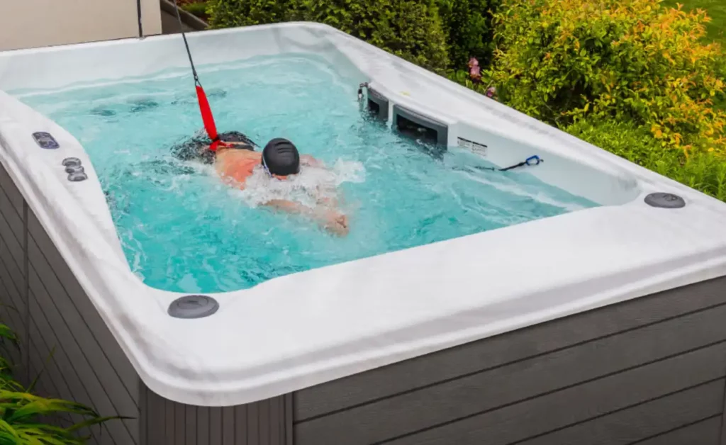man working out in swim spa the best cardio machine for weight loss