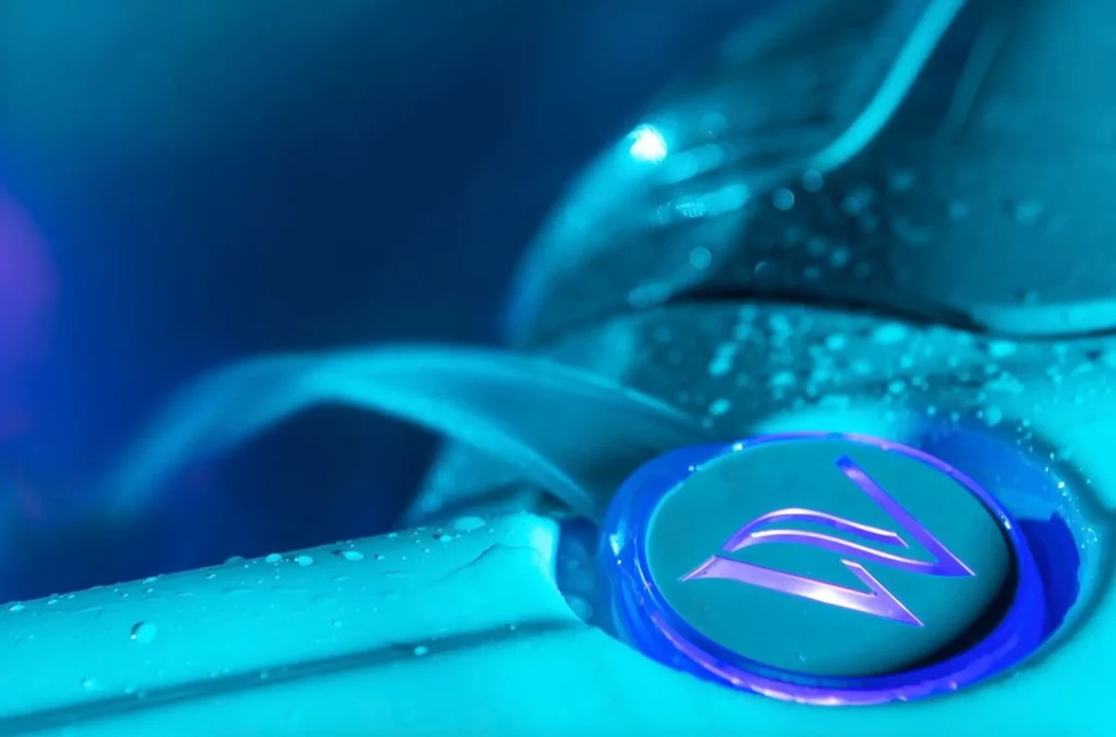 Picture of the Wellis logo illuminated by LED lighting for the article about Wellis' hot tubs energy-efficient status.