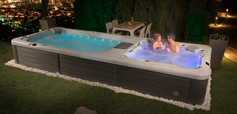 Picture of two people soaking in the Rio Grande swim spa.