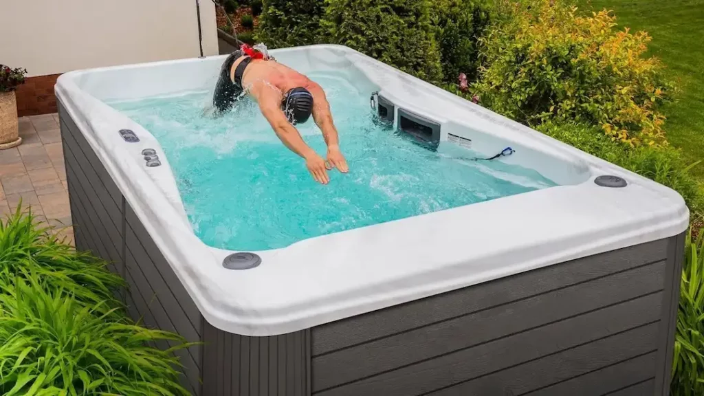 Person using a swim spa resistance band for their swim spa workout.