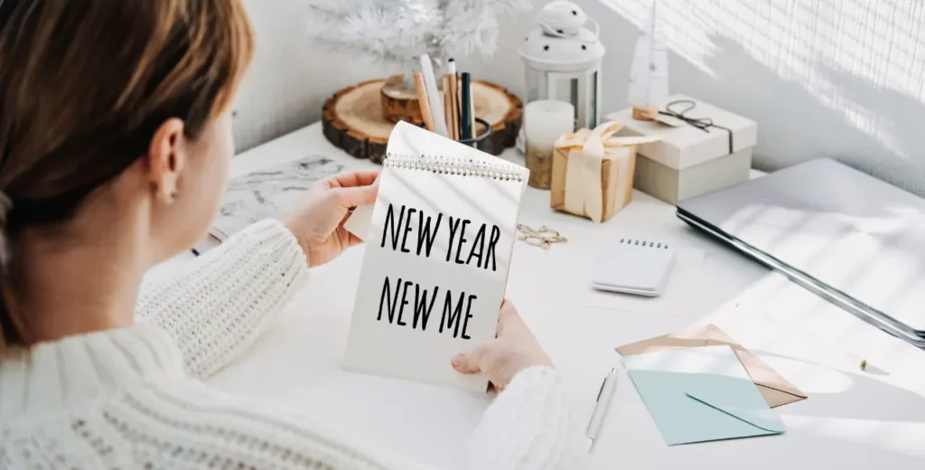 Picture of a woman reviewing the top New Year Resolutions.