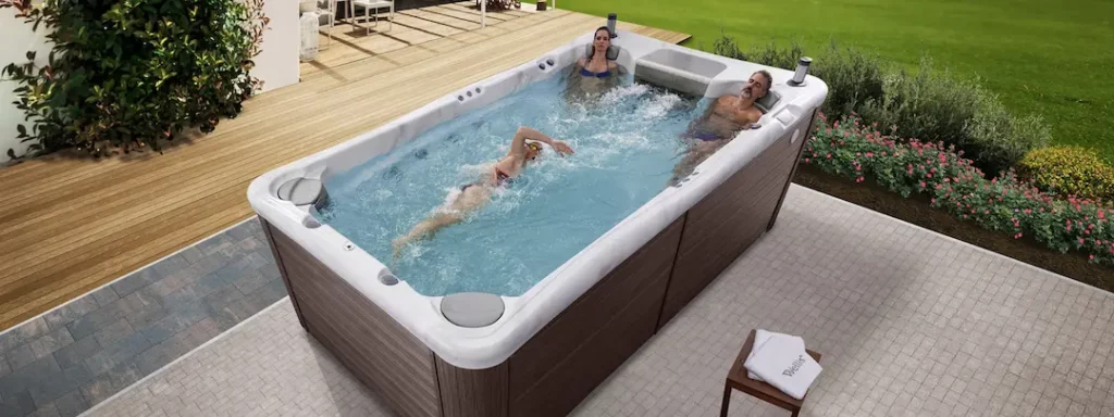Picture of three people in a swim spa for the blog, "What Is a Swim Spa?"